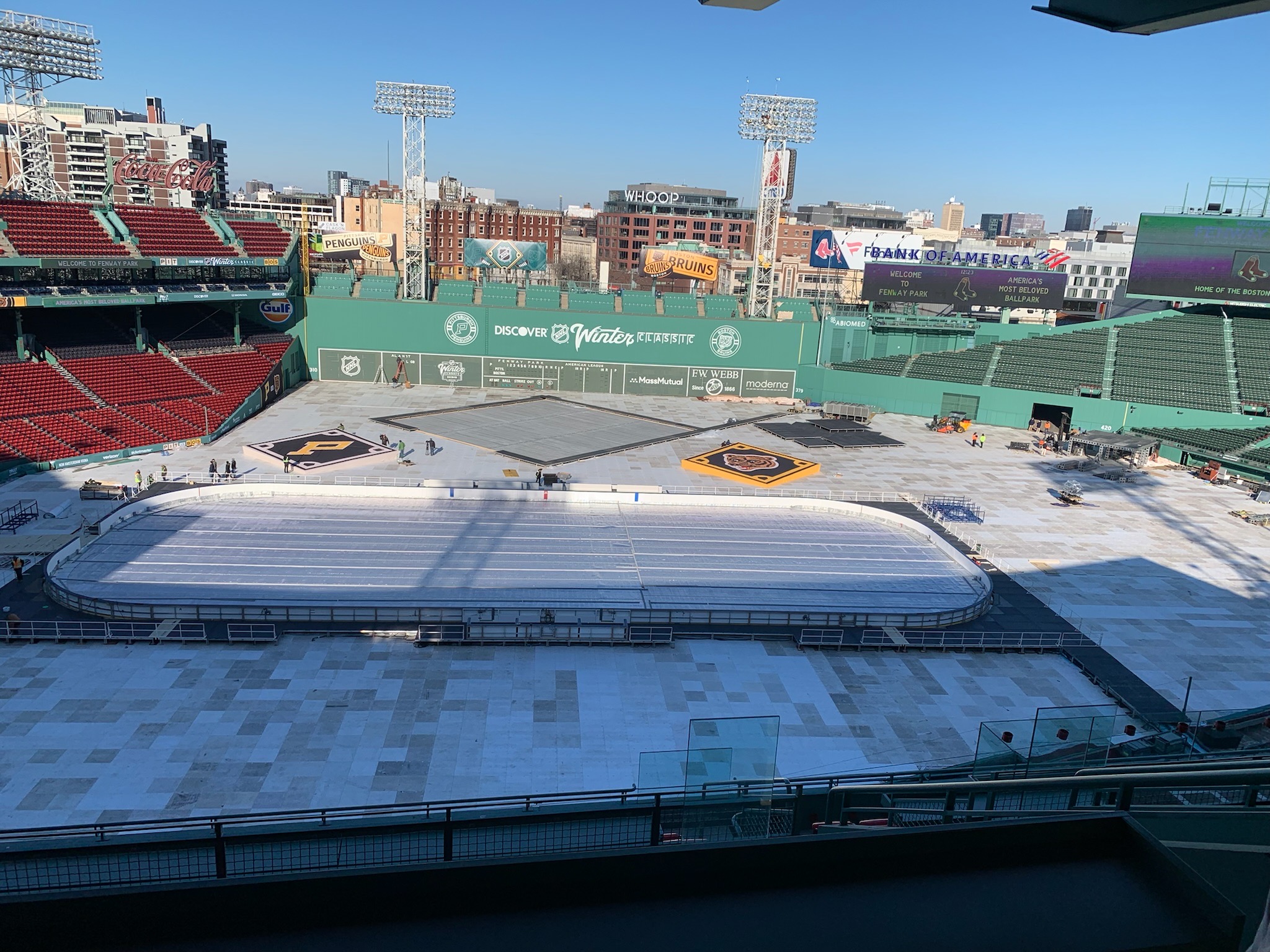 field with hockey rink being installed